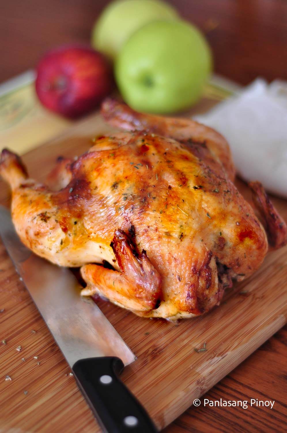 Oven baked chicken on a chopping board
