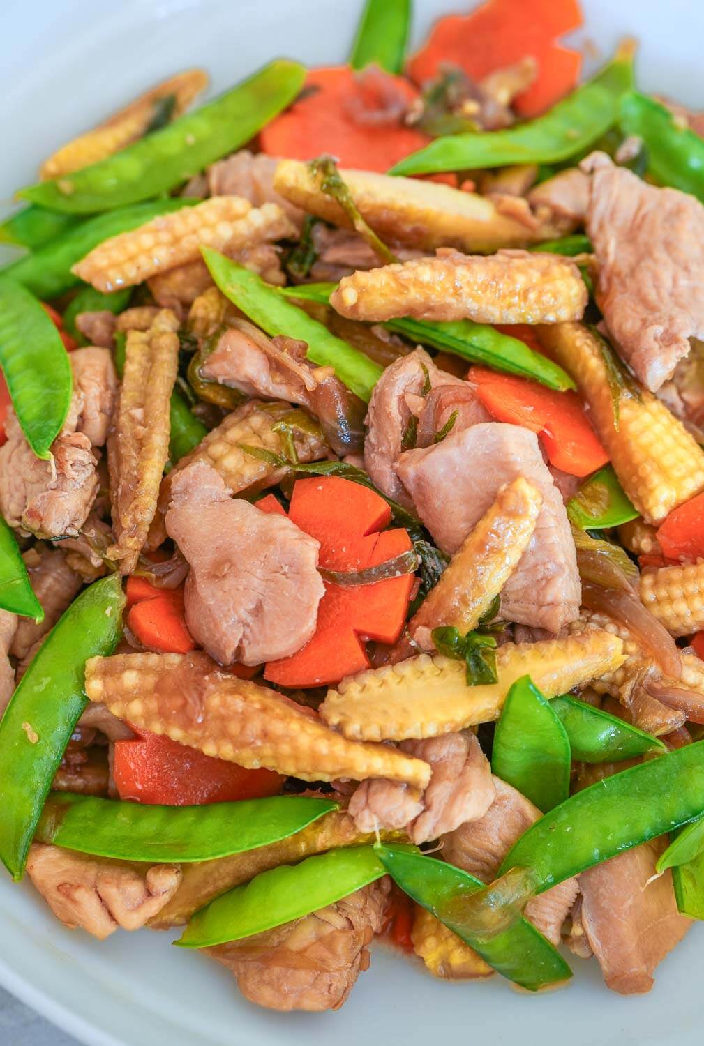 Chicken stir fry with young corn and snow peas