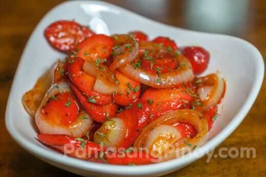 sauteed onion and hotdog with ketchup