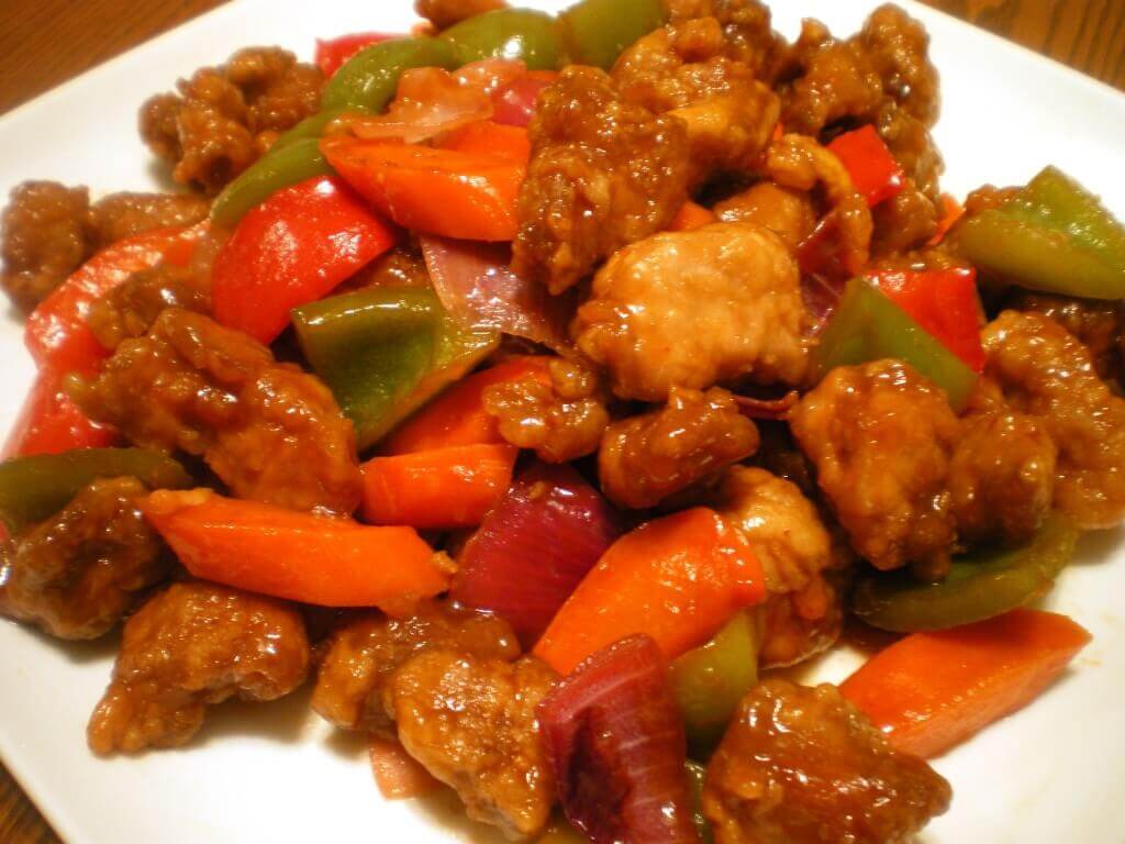 Sweet and sour pork with bell peppers on a plate