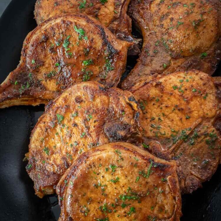 Top shot of baked pork chops on a plate