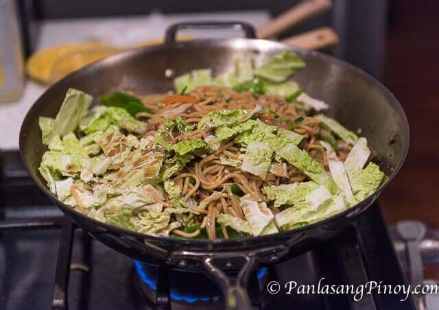 special pancit canton cooking in a stainless wok