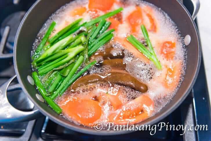 simmering tomato, tamarind, and scallions