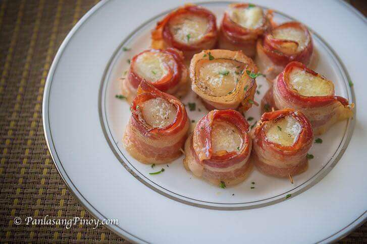bacon wrapped sea scallop in herbed butter sauce