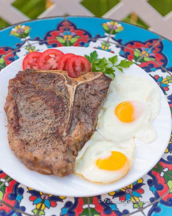 breakfast t-bone steak with eggs