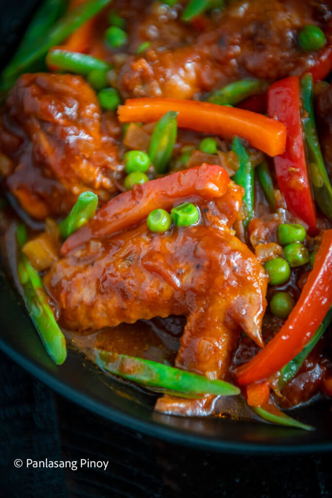 Chicken with bell peppers green beans and peas