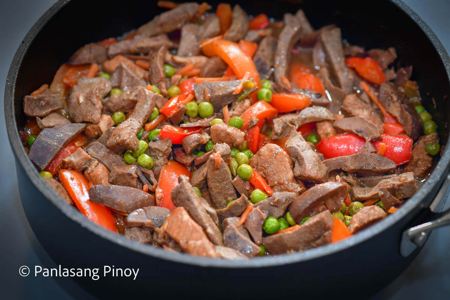 pork liver with tenderloin green peas and bell pepper