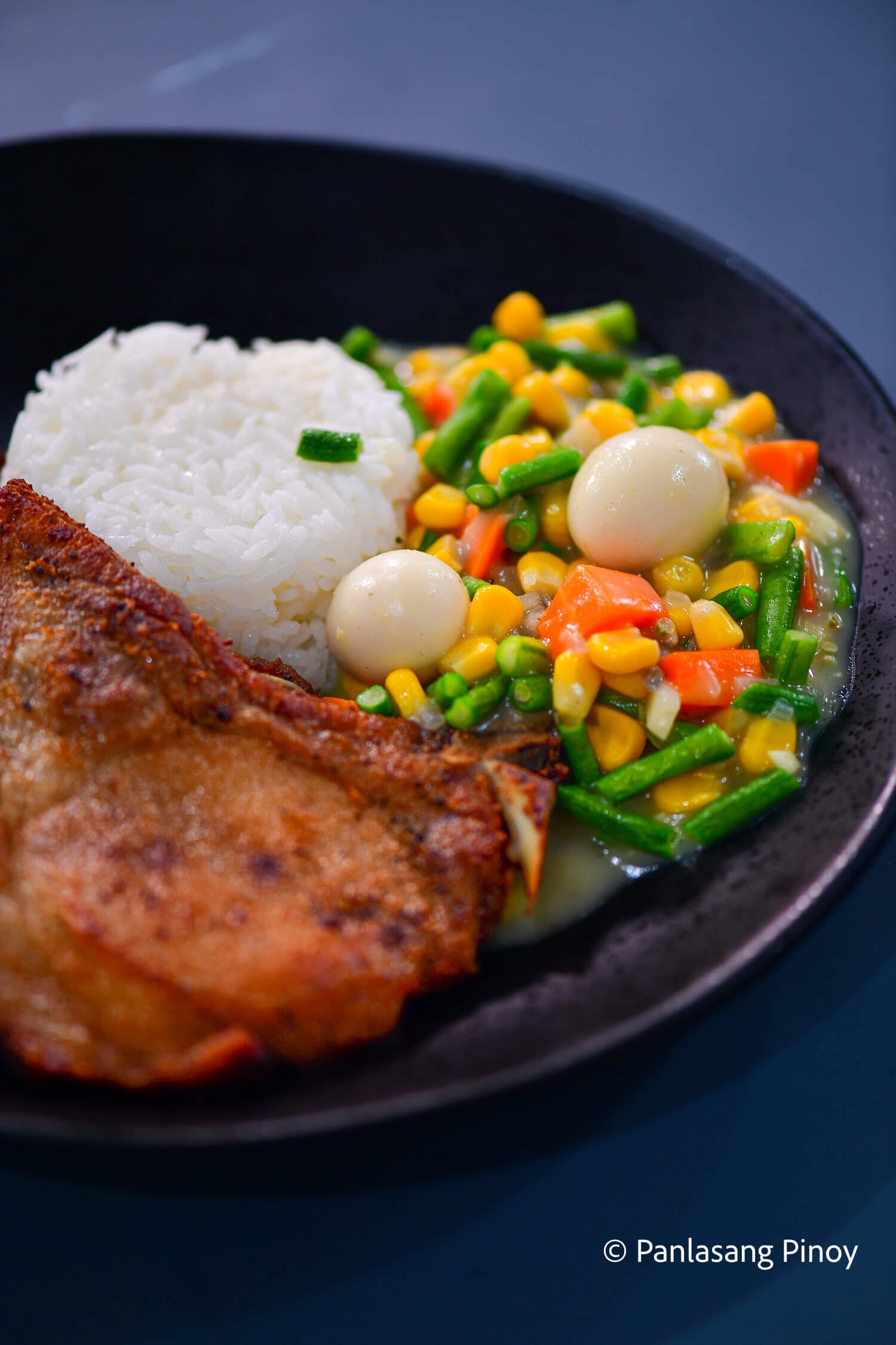 fried pork chop with rice and vegetables