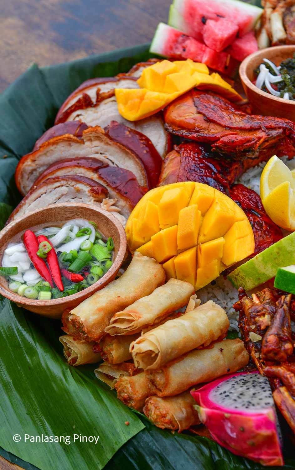 food arranged over banana leaf