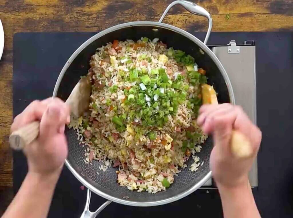 step 4 ham fried rice integrating the last few ingredients