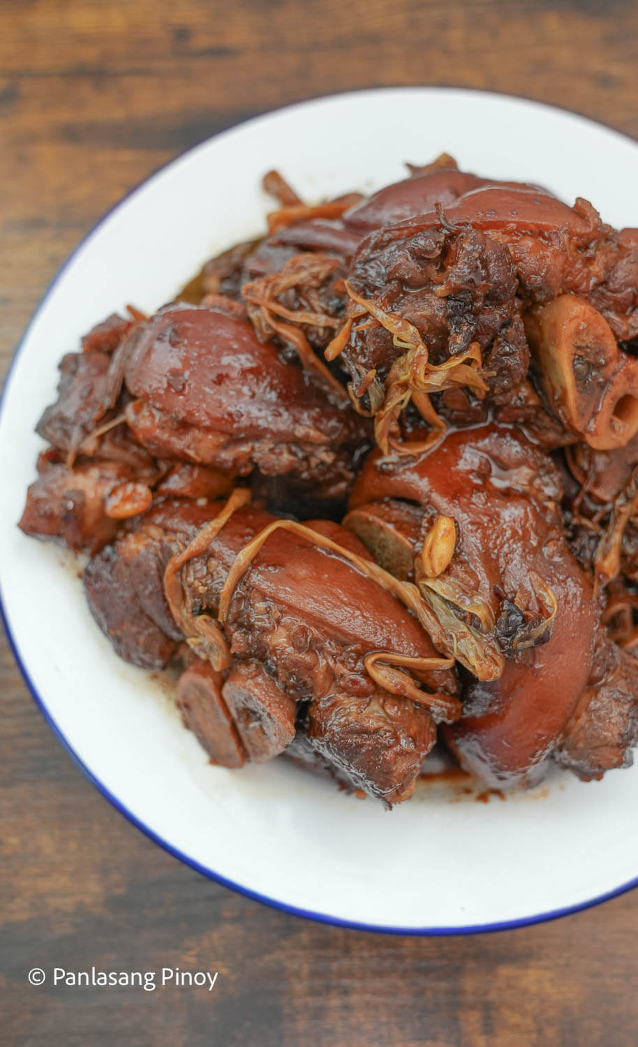 Pork humba hocks on a plate with peanuts