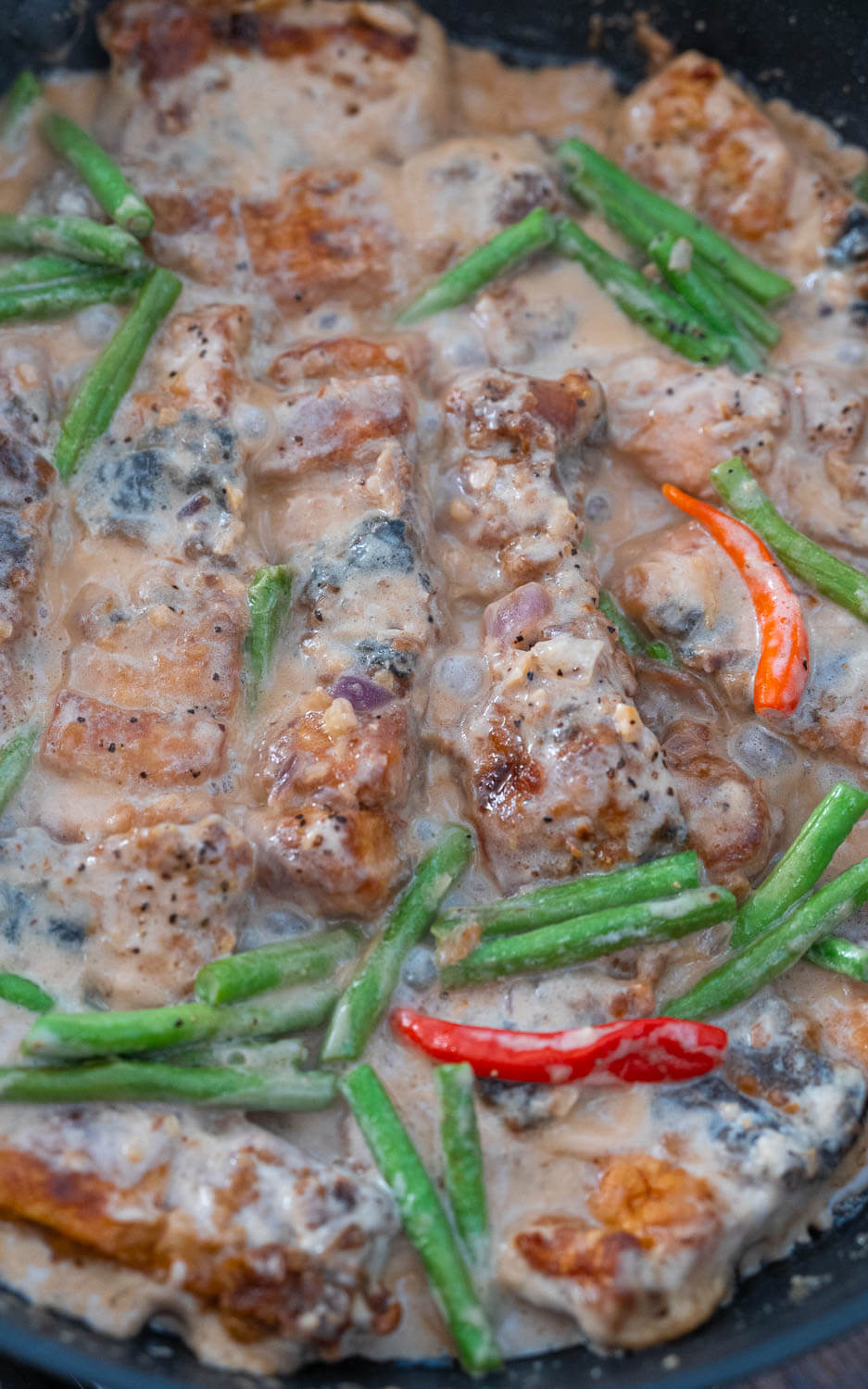 bangus belly simmering in the pan