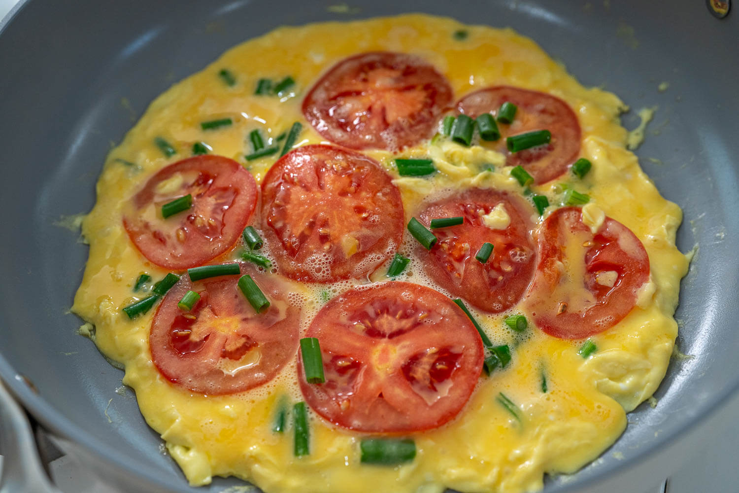 Breakfast quesadilla - cook the tomato and egg
