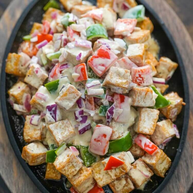 tofu sisig on a sizzling plate