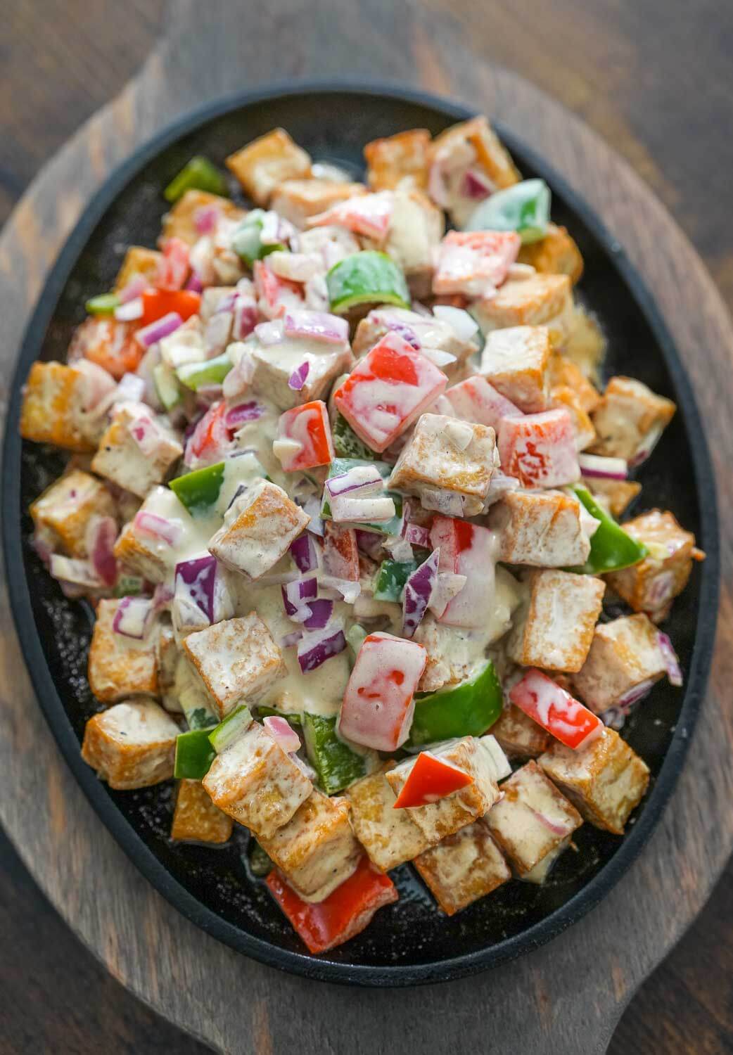 tofu sisig on a sizzling plate
