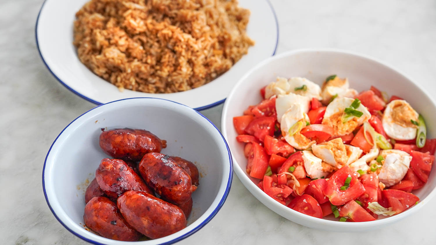 Filipino Food Breakfast Meal - Longanisa Sinangag and 
Salted Egg and Tomato Salad