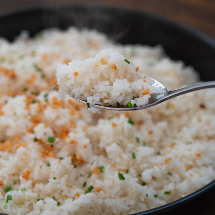 hot garlic fried rice on a spoon