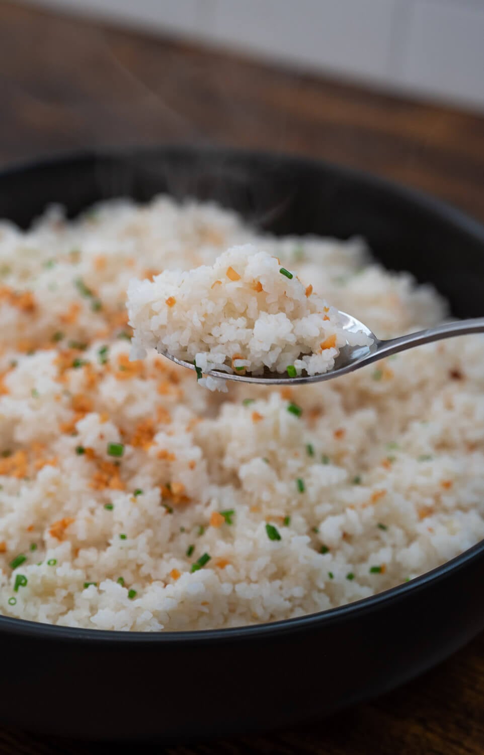 hot garlic fried rice on a spoon