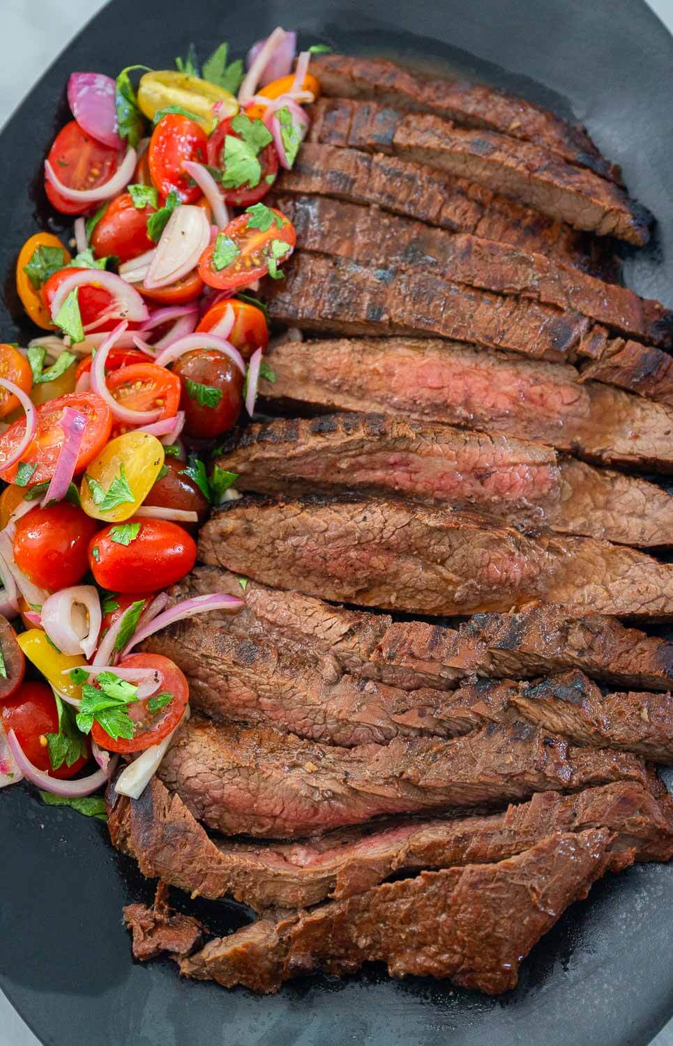 Fresh tomato salad and flank steak